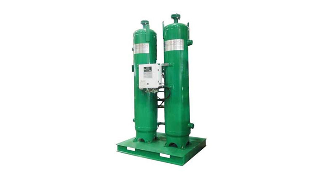 Industrial twin-tower air dryer system on a green mounting platform by Arle Compressors of Florida.