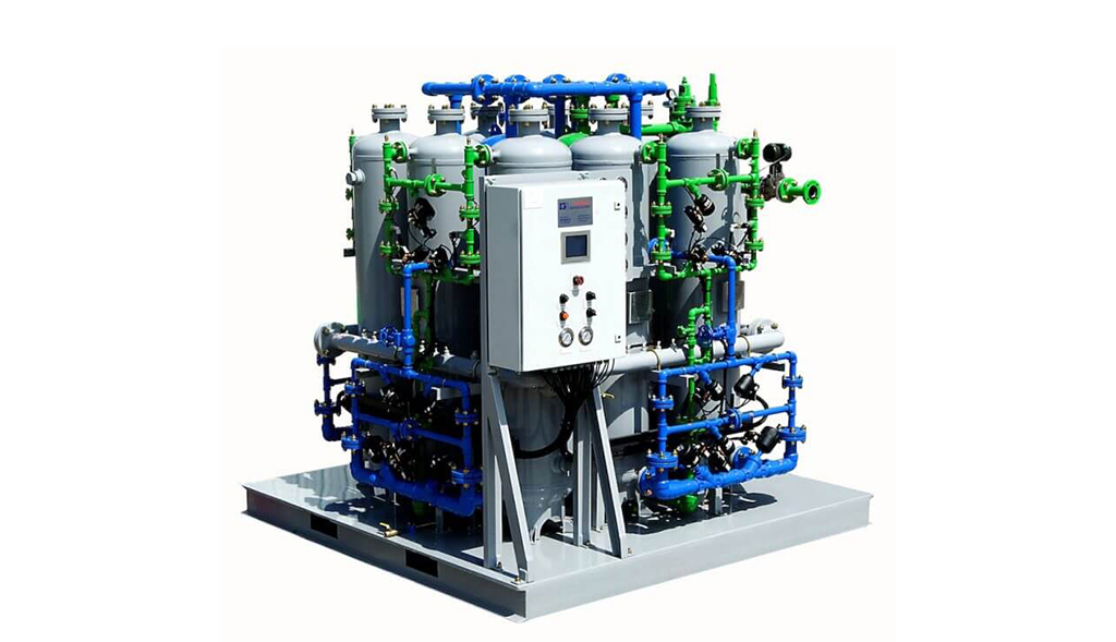 Industrial water treatment system featuring an array of pipes, valves, and tanks on a metal platform supplied by Arle Compressors of Florida.
